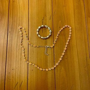 Chico’s necklace. Approximately 22” long.  It is adjustable.  Matching bracelet